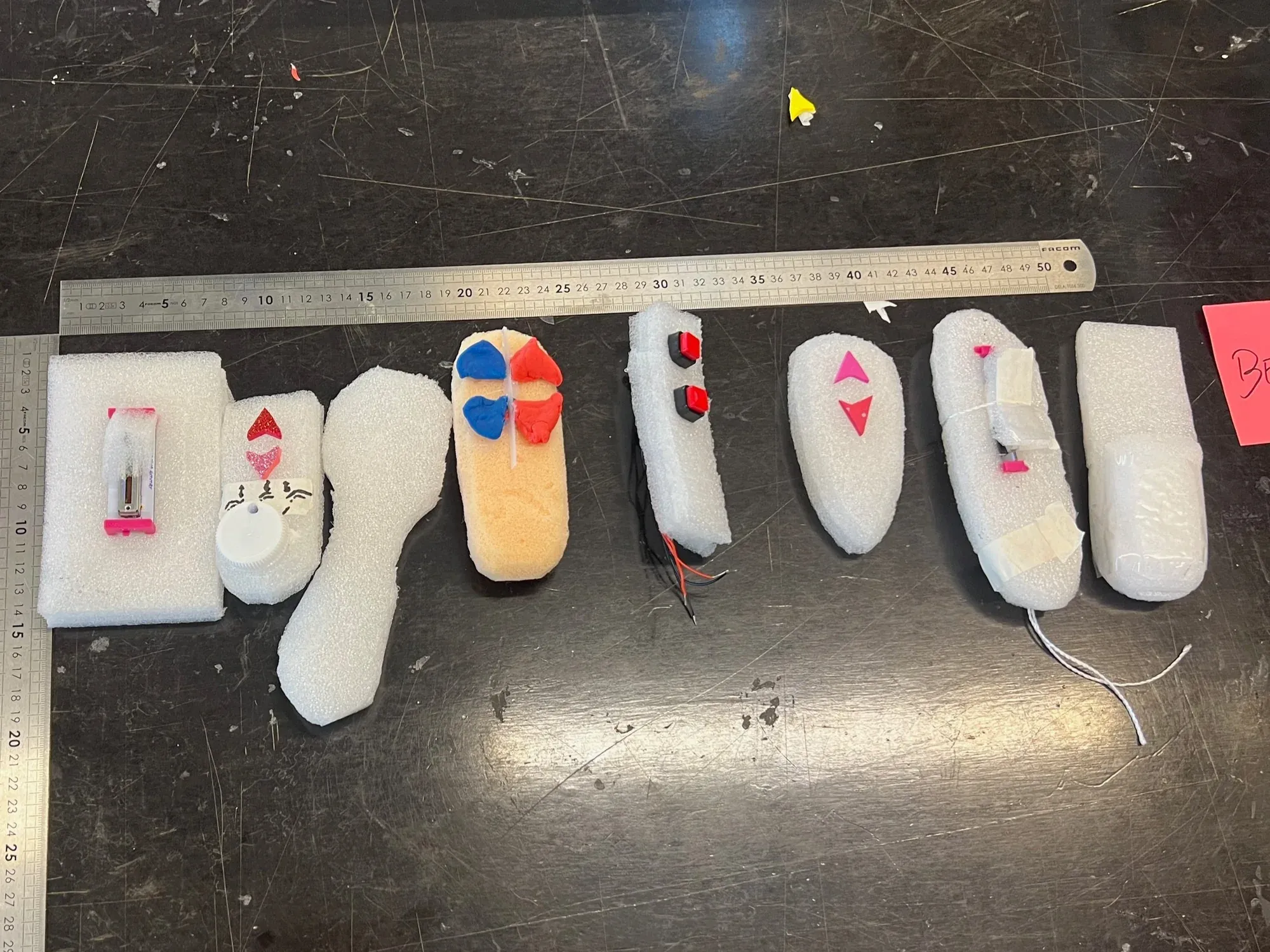 Foam and cardboard prototypes of different remote shapes