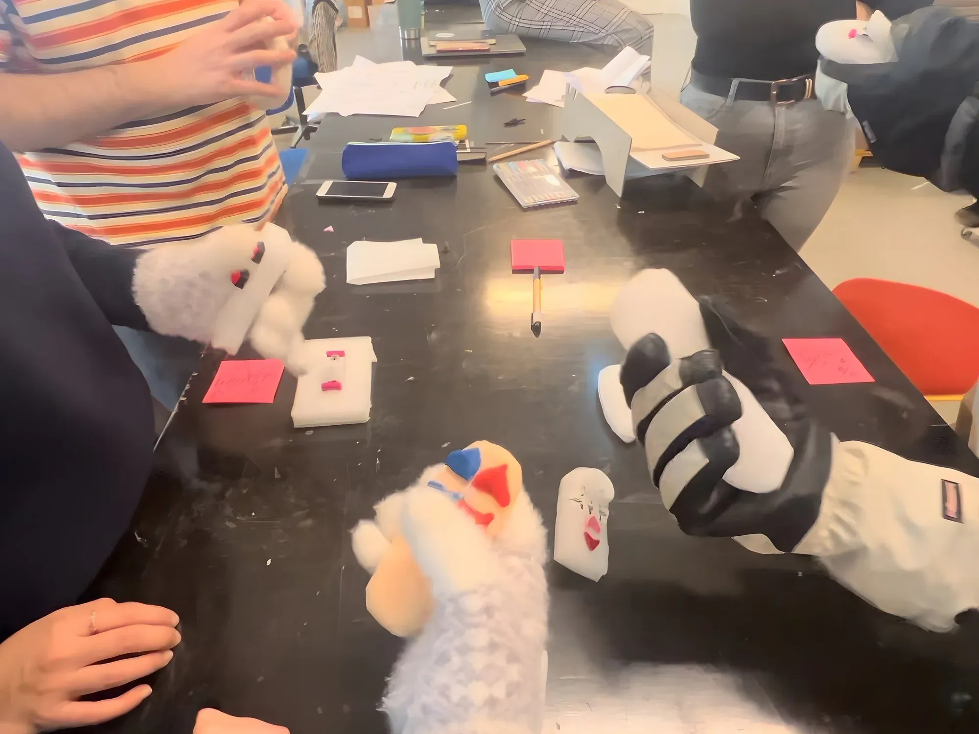 A participant testing a prototype while wearing ski gloves